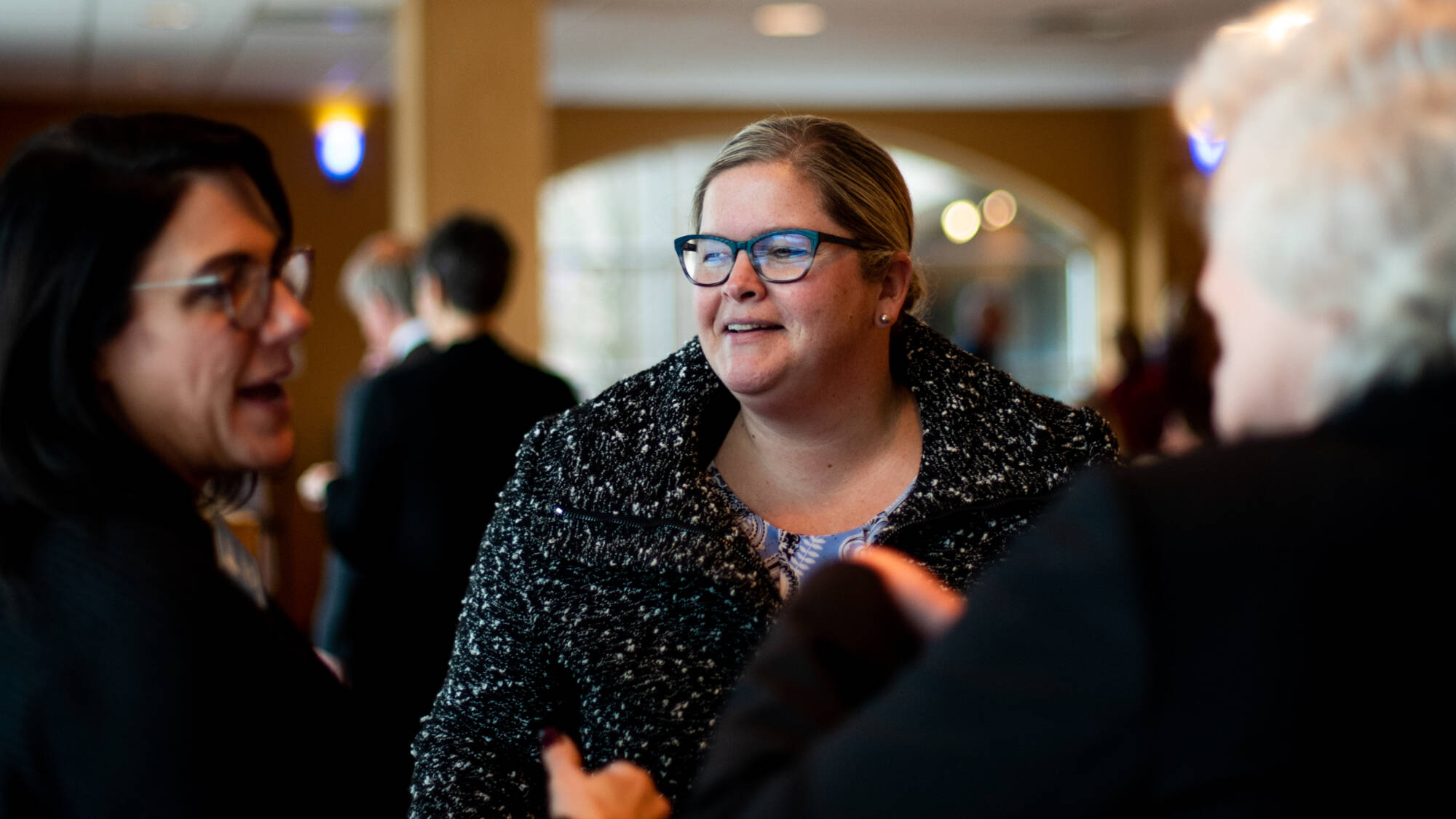 Faculty talking at a retirement party